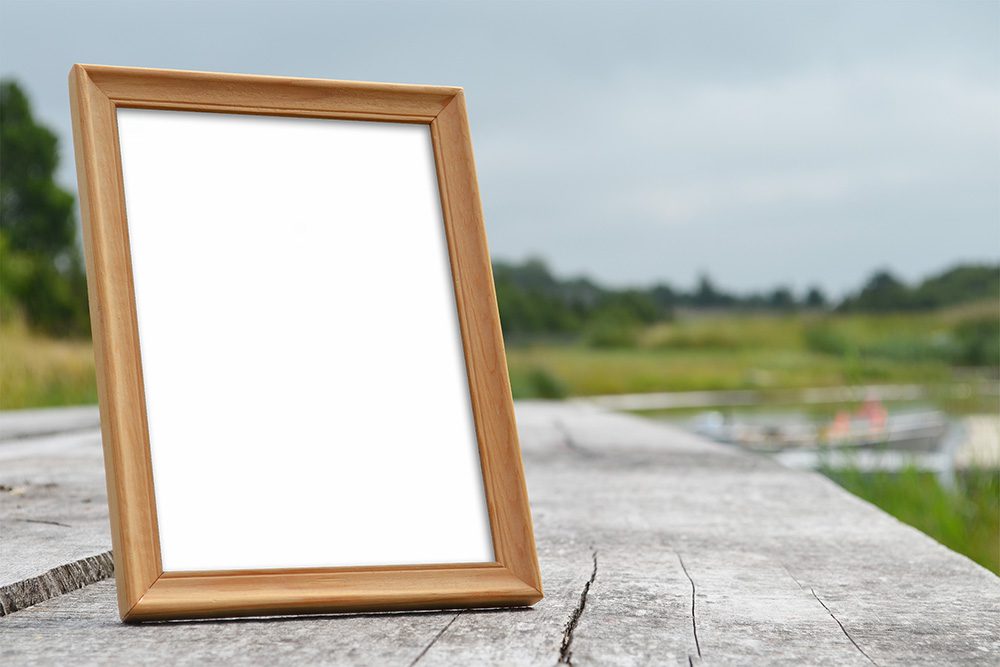 Small Photo Frame on a Table Mockup - Mockup World