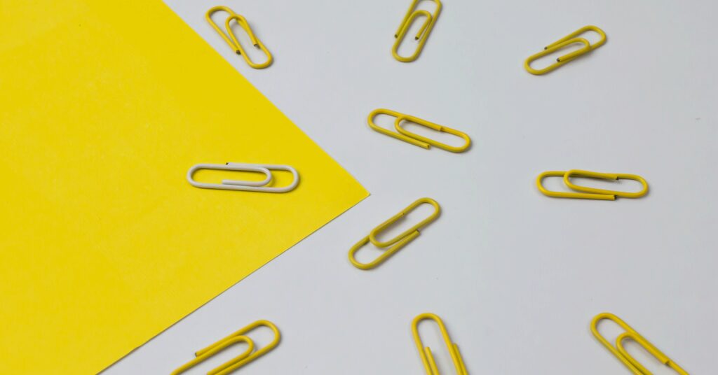 3 best marketing moments of may 2021 cover image featuring yellow paper and paperclips