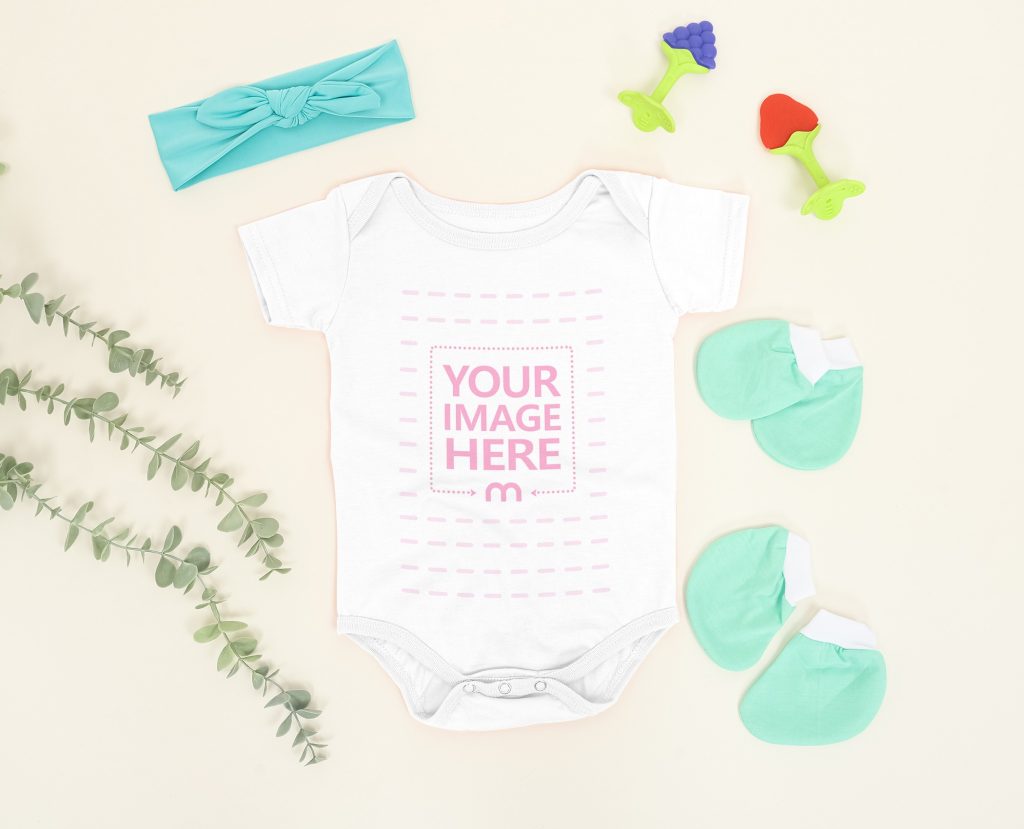 Customizable Baby Bodysuit Mockup Laid Over a Light Brown Background
