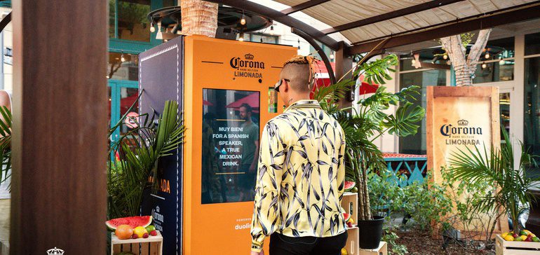 Man using the Duolingo & Corona voice-activated vending machine to get a free Hard Seltzer Limonada. 