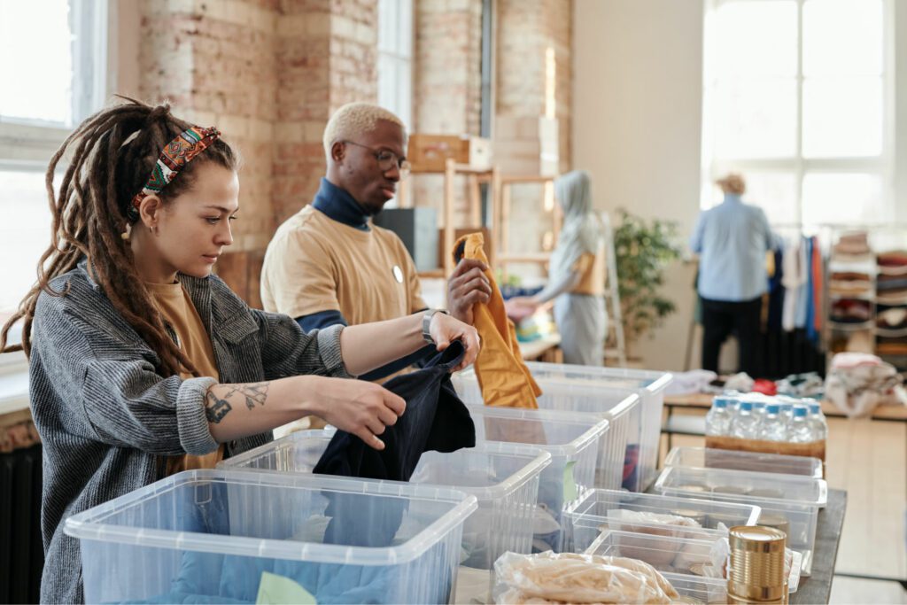 People sorting through clothes 